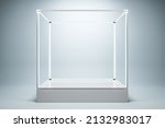 Empty illuminated glass showcase with mock up place on white wall background. 3D Rendering
