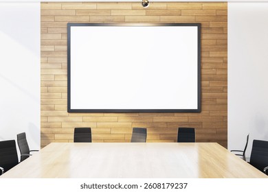 Empty office interior with a blank poster frame on a wooden wall, modern clean design with a wooden desk and chairs, concept of business space. 3D Rendering.
