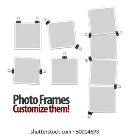 Empty photo frames with clips isolated on white background