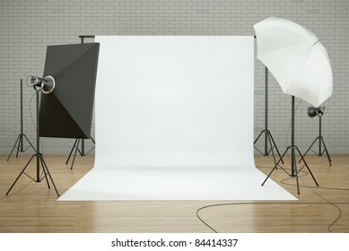 Empty Photo Studio Interior With White Background And Lighting Equipment. 3D Render.