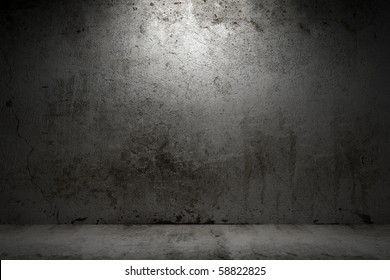 Empty Room With Grunge Concrete Wall And Cement Floor