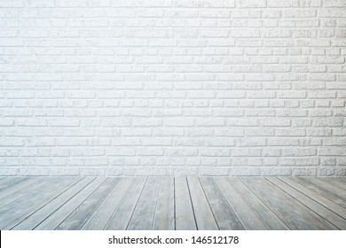 Empty Room With White Brick Wall And Wooden Floor