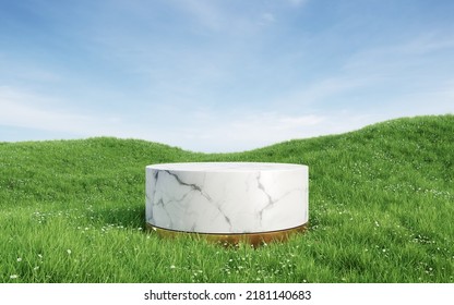 Empty Round White Marble Podium With Metallic Gold Base On Grass Field. 3d Rendering Image For Product Display.