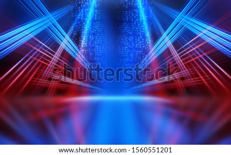 Empty show scene background. Reflection of a dark street on wet asphalt. Rays of red and blue neon light in the dark, neon shapes, smoke. Abstract dark background.