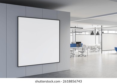Empty square poster mockup on a wall in a modern open-plan office interior with minimalistic decor, sleek furniture, and bright natural lighting. 3D Rendering - Powered by Shutterstock - Get 15% off with code: PIKWIZARD15