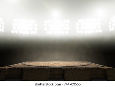 An Empty Traditional Sumo Wrestling Ring Made With Sand Lit By Arena Spotlights On A Dark Background - 3D Render