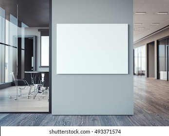 Empty White Canvas On The Modern Office Gray Wall. 3d Rendering