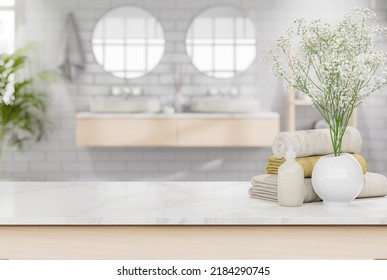 Empty White Mable Top Table For Copy Space Decorate With Liquid Soap Bottle,cotton Towels And Flower Pot With Blurry Bathroom Background 3d Render