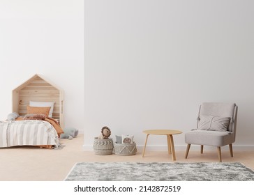 Empty White Wall In Modern Child Room. Mock Up Interior In Scandinavian, Boho Style. Copy Space For Your Picture Or Poster. Bed, Armchair, Toys, Rattan Basket. Cozy Room For Kids. 3D Rendering.