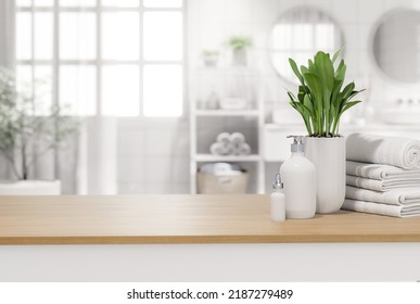 Empty Wooden Table Table Top For Copy Space Decorate With Liquid Soap Bottle,cotton Towels And Plant Pot With Blurry Bathroom Background 3d Render