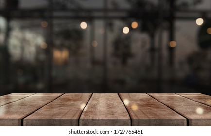 Empty Wooden Table Top On Abstract Blur Coffee On Background.