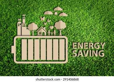 energy saving concept. Paper cut of eco on green grass.