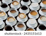 An enticing aerial display of multiple cups of coffee, capturing espresso to cappuccino, emphasizing the diversity and artistry of coffee preparation methods and styles.