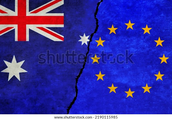 European Union and Australia flags on a wall with\
a crack. Australia and European Union flags together. EU Australia\
alliance, politics, economy, trade, relationship and conflicts\
concept