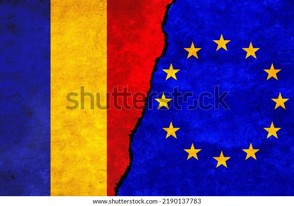 European Union and Romania flags on a wall with a\
crack. Romania and European Union flags together. EU Romania\
alliance, politics, economy, trade, relationship and conflicts\
concept