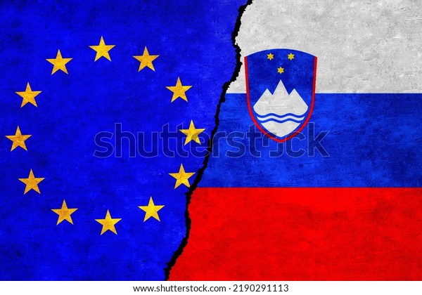European Union and Slovenia flags on a wall with\
a crack. Slovenia and European Union flags together. EU Slovenia\
alliance, politics, economy, trade, relationship and conflicts\
concept