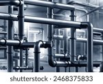 Factory basement. Metal pipeline. Pipes in workshop of industrial company. Basement of chemical manufactory. Steel pipes are intertwined. Industrial background. Pipes in enterprise building. 3d image