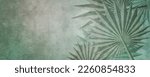 Faded. abstract, palm leaves over green, gray and gold. Illustration is stylized with aged, vintage appearance. 