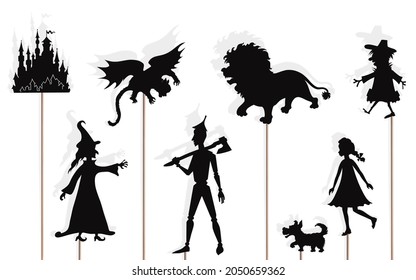 Fairytale shadow puppets of lion, girl and her dog, scarecrow and tin woodman, isolated on white background. 
