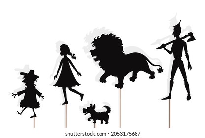 Fairytale shadow puppets of lion, girl and her dog, scarecrow and tin woodman, isolated on white background. 