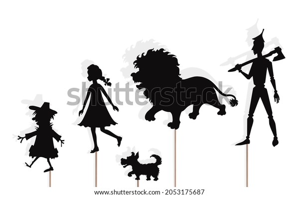 Fairytale shadow\
puppets of lion, girl and her dog, scarecrow and tin woodman,\
isolated on white background.\
