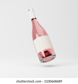 Falling heavy glass bottle of rose wine with blank label isolated over white background. Mockup template. 3d rendering. - Powered by Shutterstock