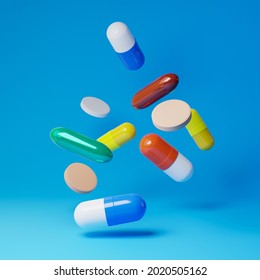 Falling medicine pills and antibiotics isolated over blue background. Healthcare and medical concept. 3D rendering.