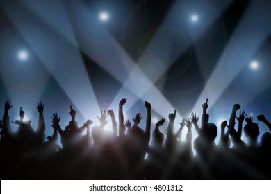 Fans raise their hands at concert