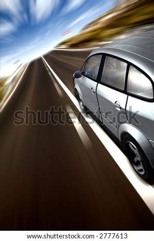 fast car on a tarmac road in the countryside