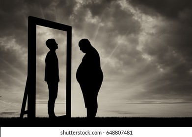Fat Sad Man And His Reflection In The Mirror Of A Normal Man Against Sky. Obesity Concept