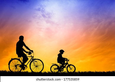 Father and son biking at sunset - Powered by Shutterstock