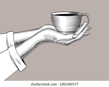 Female hands holding Coffee