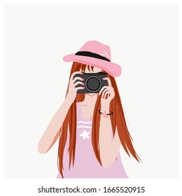 A female photographer is taking pictures with her camera, - Powered by Shutterstock