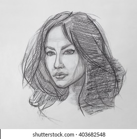 Female Portrait. Pencil Drawing. The Fine Art Portrait Of The Young Woman. Female Face. Human Head. Sketch. Hand Drawing. It Is A Pencil Drawing.