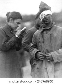 Female Salvation Army Worker Writing A Letter To The Home Folks For The Wounded WWI Soldier. Ca. 1917-18.