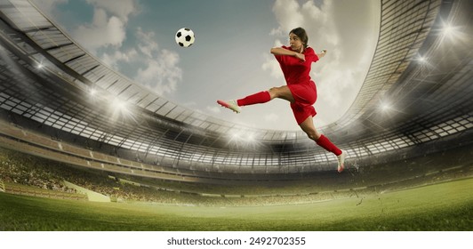 Female soccer player in red performs high jump kick on stadium field. Arena packed with spectators, and bright spotlights illuminate scene. Concept of sport, championship, team game, tournament. Ad - Powered by Shutterstock