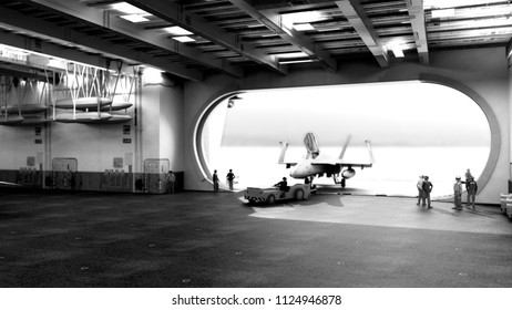 fighter aircraft on the inner deck of an aircraft carrier 3d render