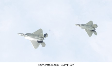 Fighter jets flying above the clouds
