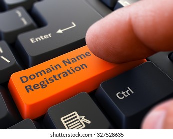 Finger Presses Orange Button  Domain Name Registration on Black Keyboard Background. Closeup View. Selective Focus.
