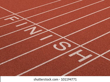Finish Line as a business symbol of success in completing a planned strategy to achieve victory and reach the goals of financial freedom and wealth as a track and field background in perspective.