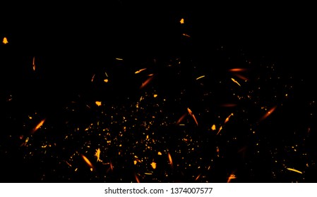 Fire particles effect dust debris isolated on black background, motion powder spray burst.