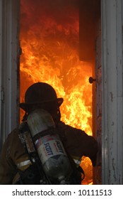 Firefighter Entering Burning House