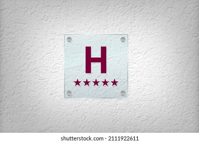 Five Star Hotel Symbol, Sign On The Side Of A House Door, Facade. H And Number Of Stars Meaning Quality Of Hotel In Portugal	