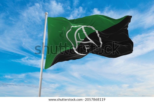 flag of Animal Liberation Front   at cloudy\
sky background on sunset, panoramic view. Anarchism symbol. copy\
space for wide banner. 3d\
illustration