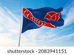 flag of Camrose, Alberta , Canada at cloudy sky background on sunset, panoramic view. Canadian travel and patriot concept. copy space for wide banner. 3d illustration