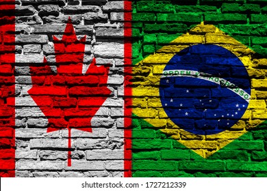 Flag of Canada and Brazil on brick wall
