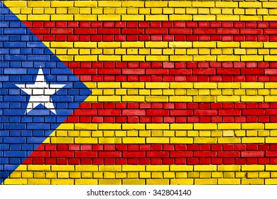 Flag Of Catalan Independence Movement Painted On Brick Wall