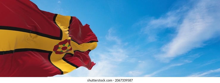 flag of county Northamptonshire, UK at cloudy sky background on sunset, panoramic view. County of united kingdom of great Britain, England. copy space for wide banner, 3d illustration