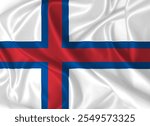 The flag of the Faroe Islands fluttering in the wind