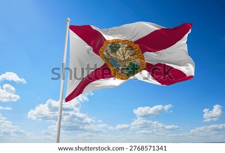 flag of Florida at cloudy sky background on sunset. Patriotic concept about state. 3d illustration.